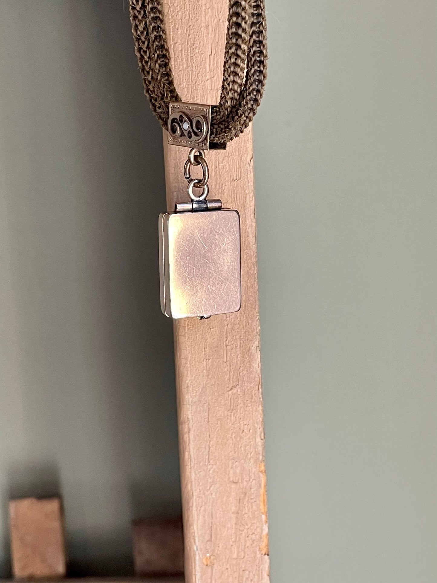 A Victorian Braided Hair Watch Chain with 10K Rose Gold Locket