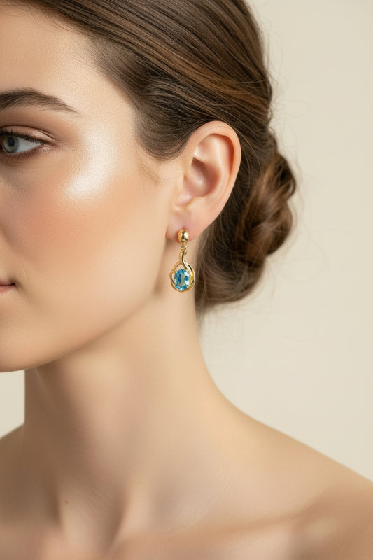 A Pair of Oval Cut Blue Topaz 10K Yellow Gold Earrings