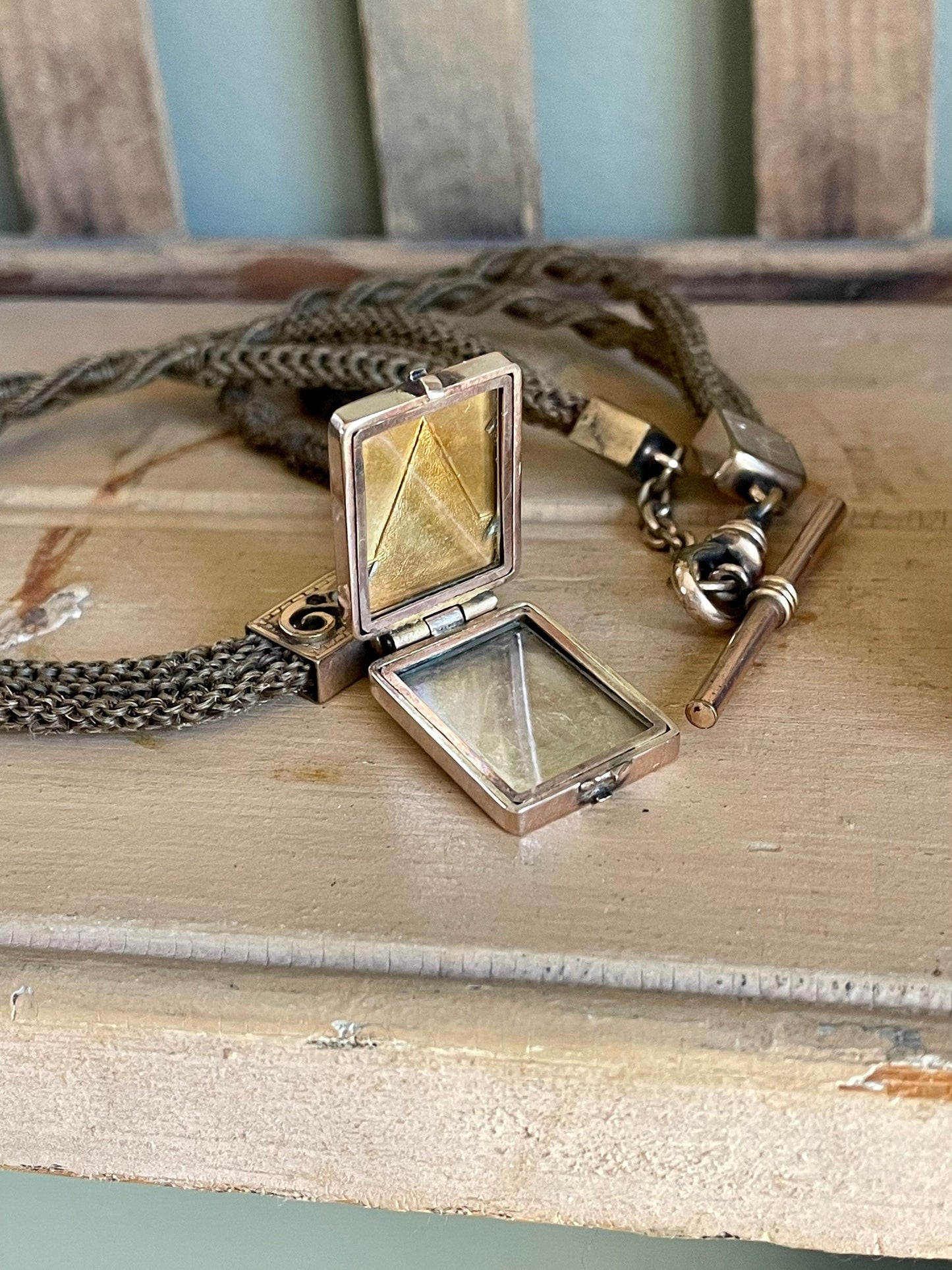 A Victorian Braided Hair Watch Chain with 10K Rose Gold Locket