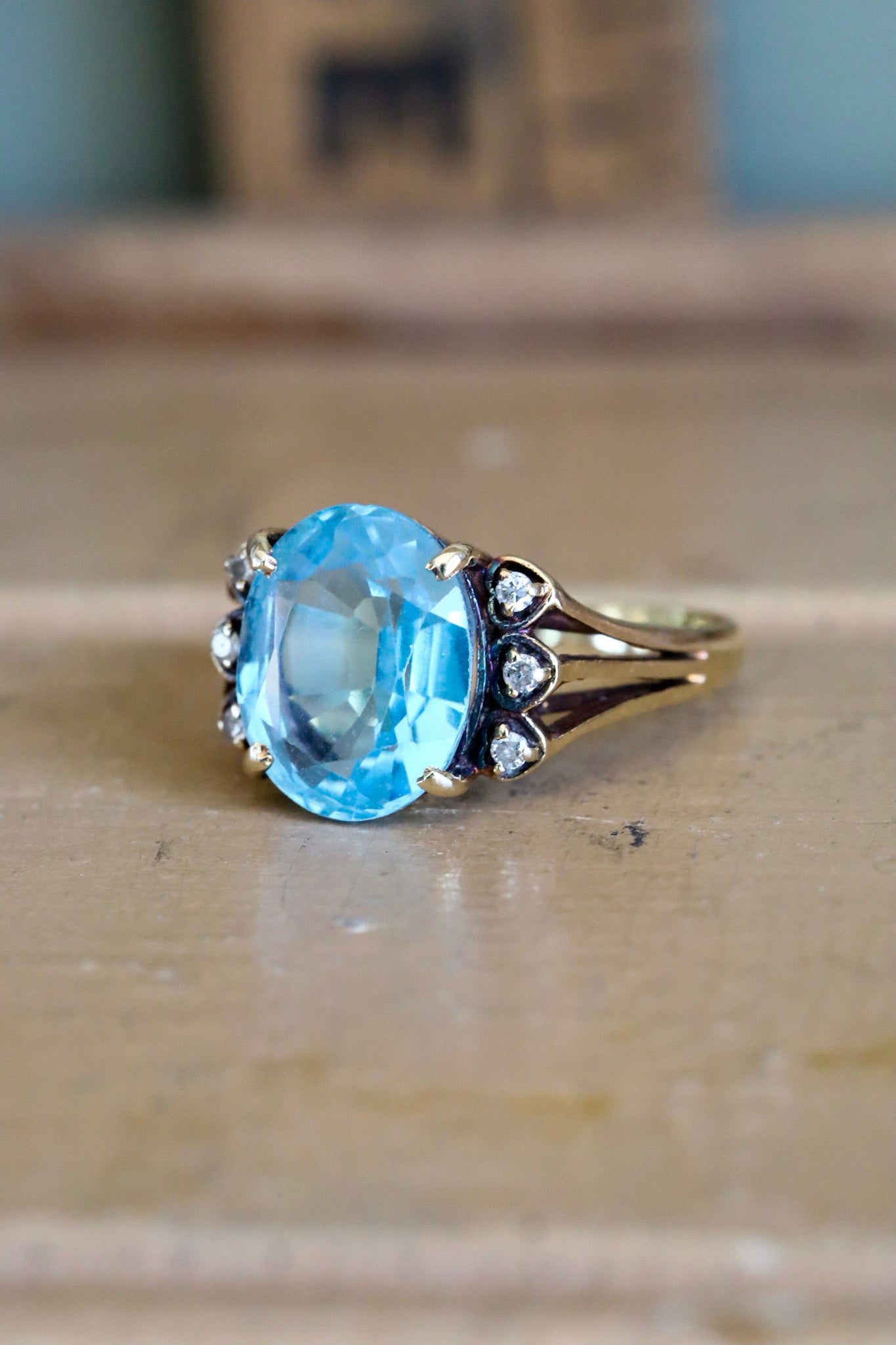 A Mid-Century 14K Yellow Gold Oval Blue Topaz and Diamond Ring