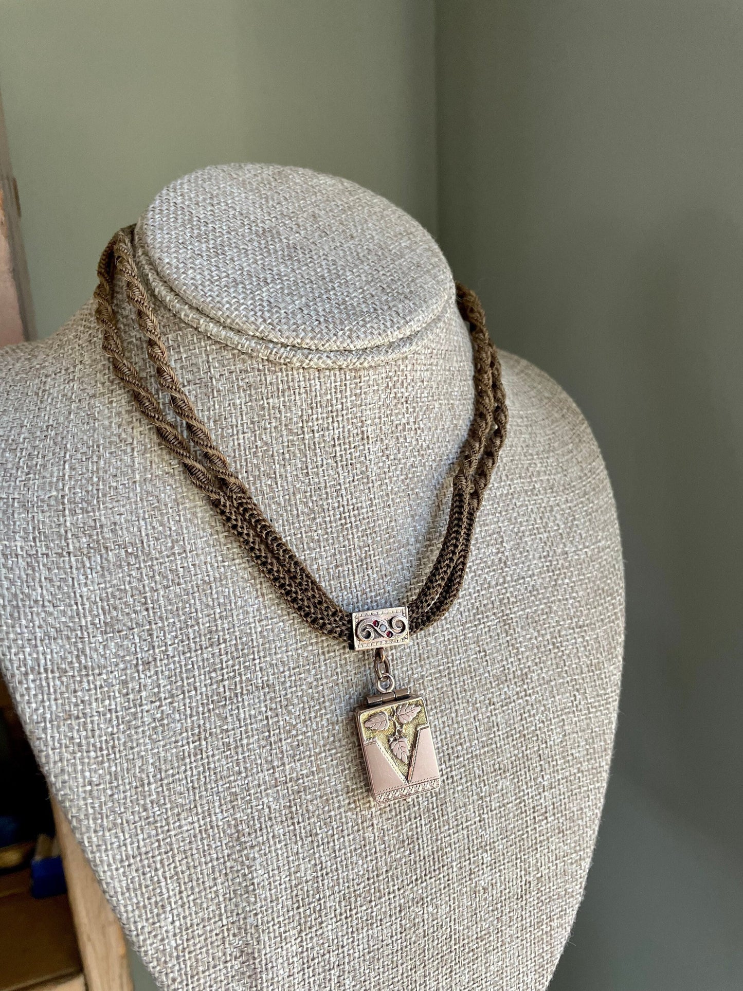 A Victorian Braided Hair Watch Chain with 10K Rose Gold Locket