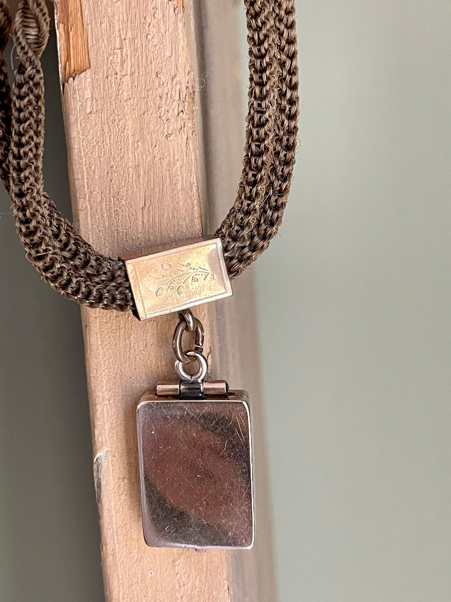 A Victorian Braided Hair Watch Chain with 10K Rose Gold Locket