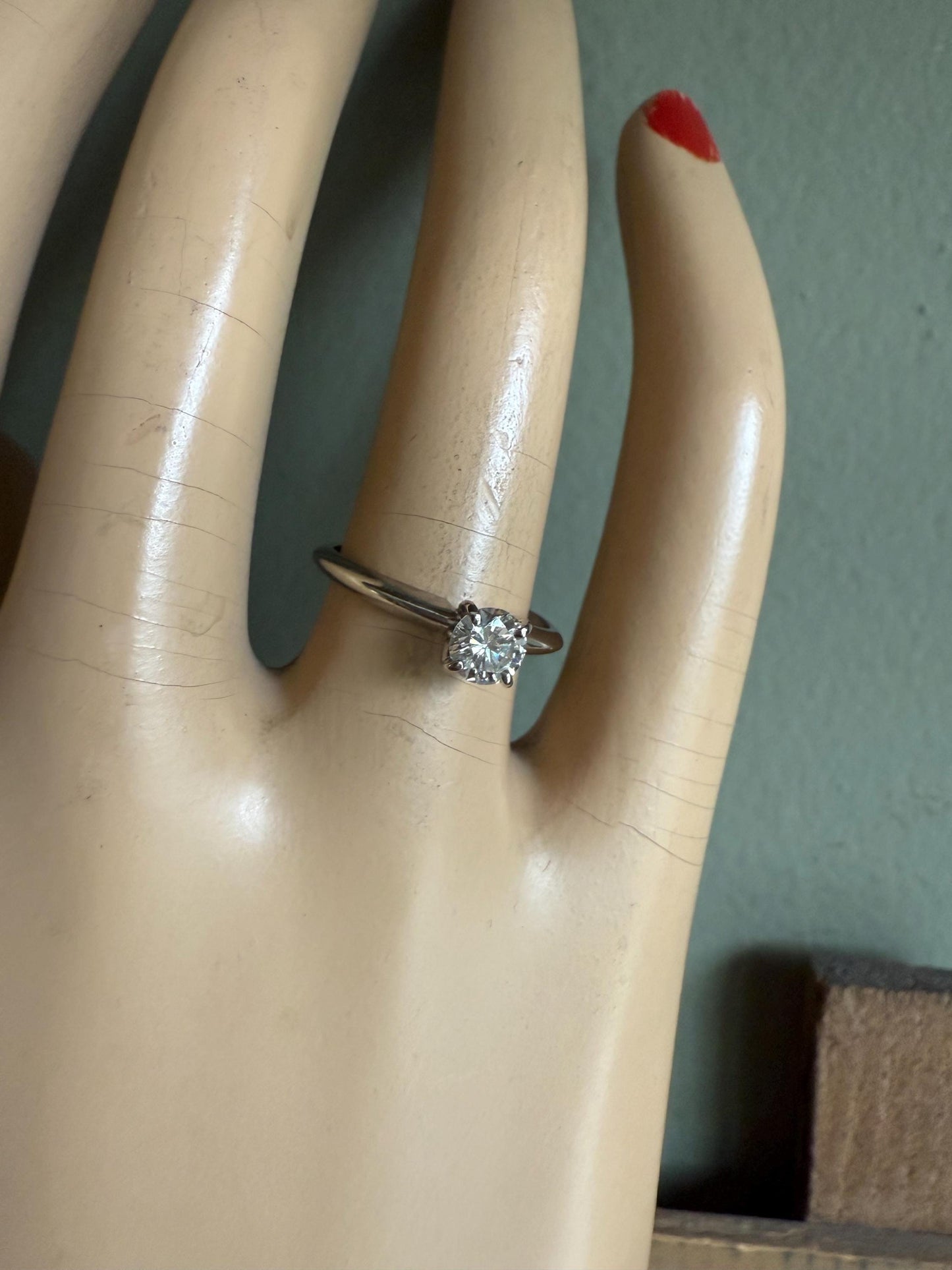 A GIA certified .42 ct Round Brilliant Cut Natural Diamond in 14K White Gold