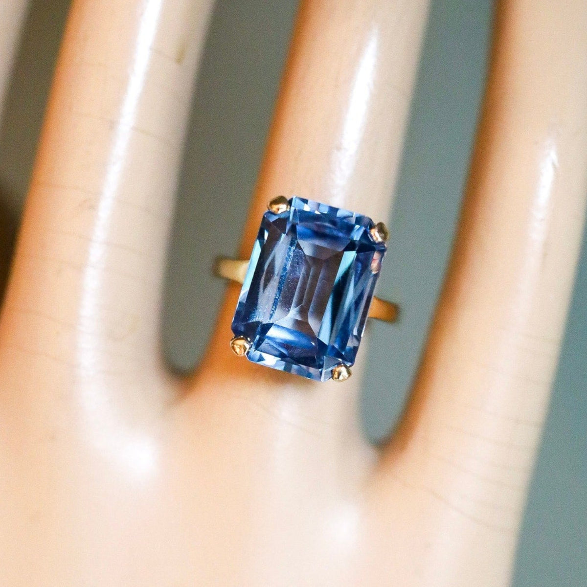 A Dramatic 14K Yellow Gold Ring Featuring a Rectangle Cut Blue Topaz