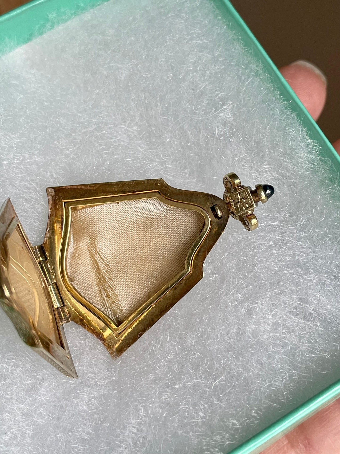 An Fine Edwardian 14K Yellow Gold Engine Turned Locket with Sapphire Cabochon Push Clasp