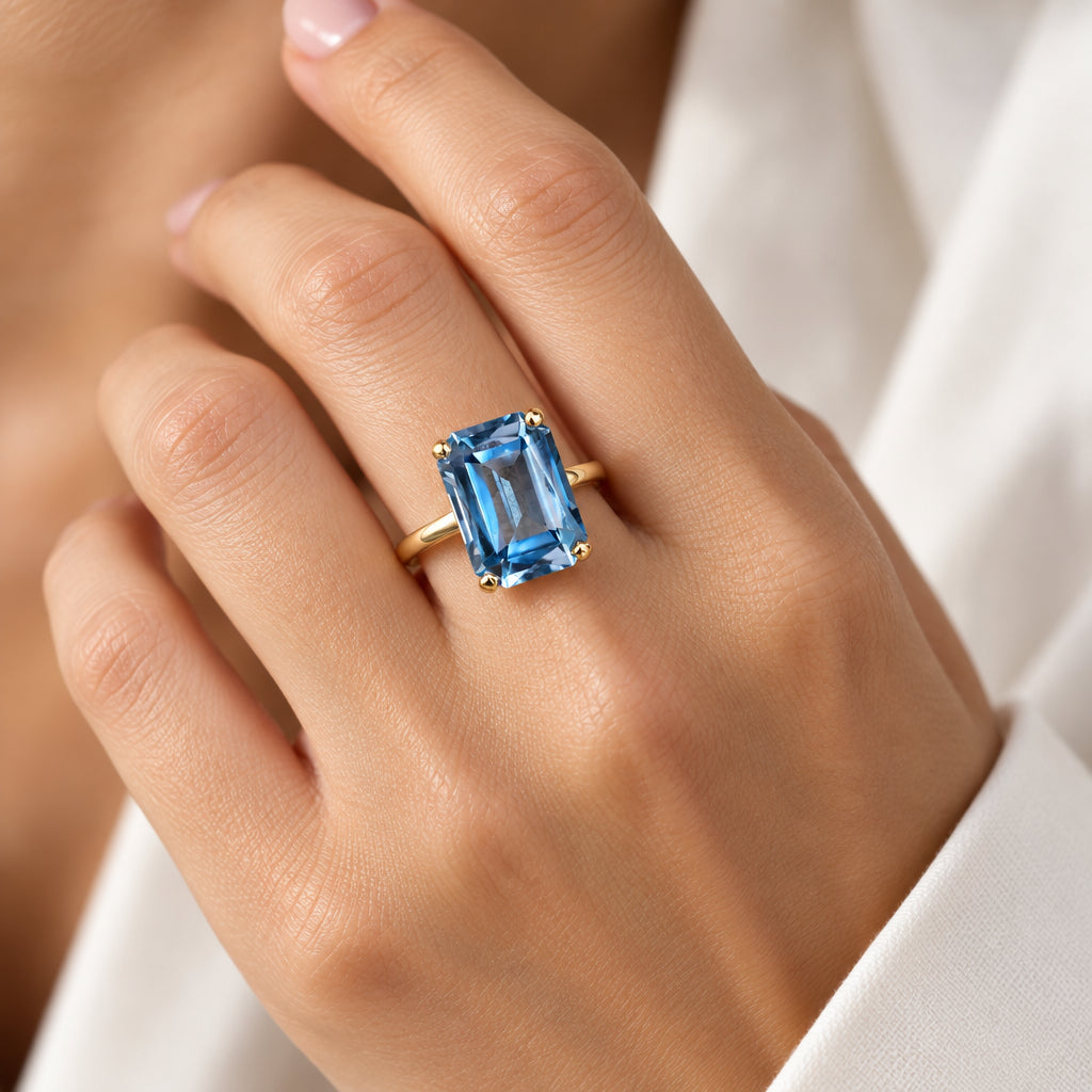 A Dramatic 14K Yellow Gold Ring Featuring a Rectangle Cut Blue Topaz