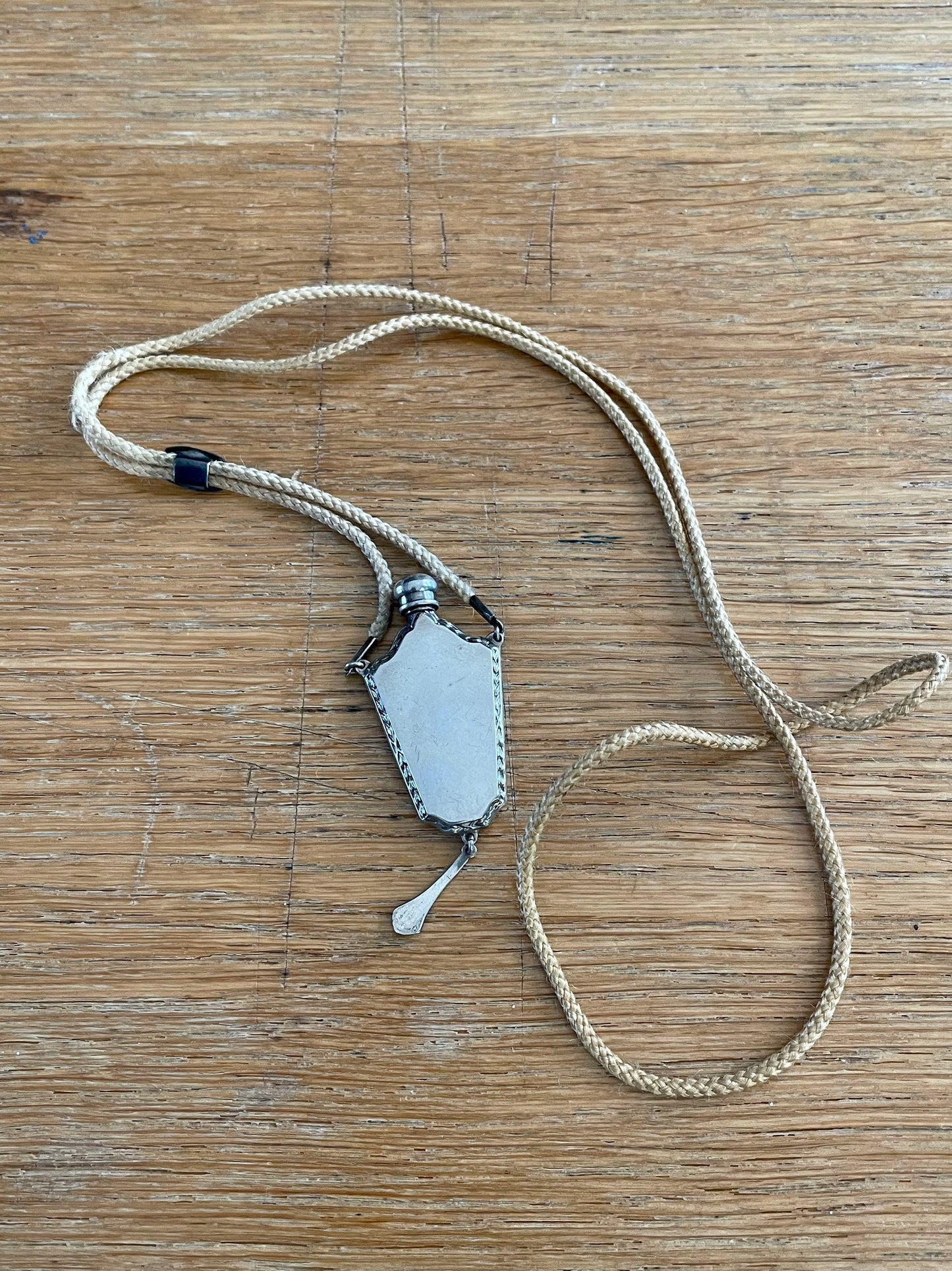 c1920-1930 Sterling Silver Guilloche Perfume Bottle on Original Braided Cord with Slide