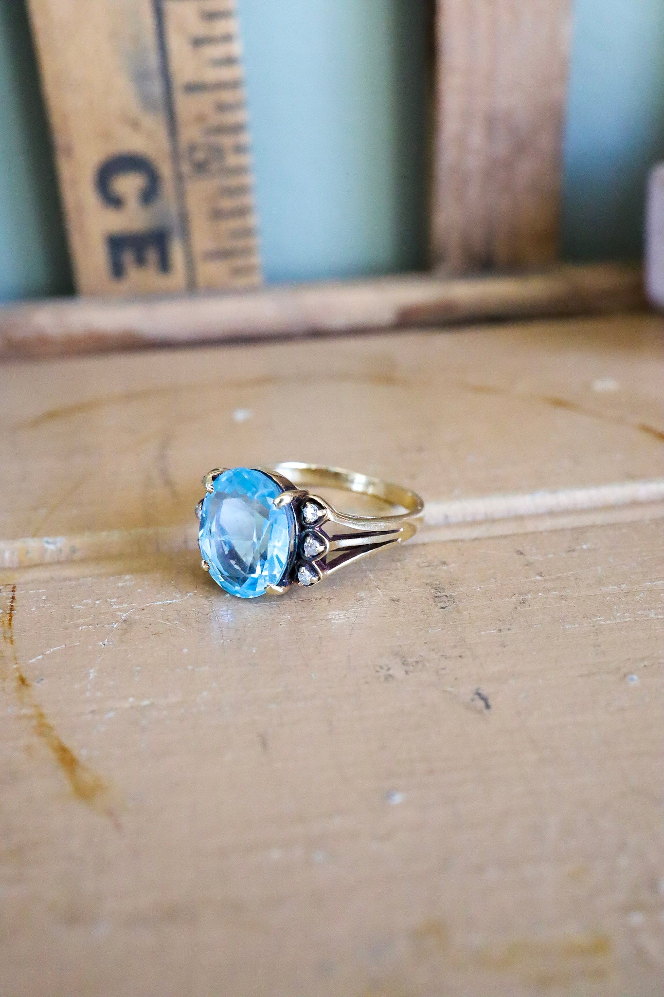 A Mid-Century 14K Yellow Gold Oval Blue Topaz and Diamond Ring