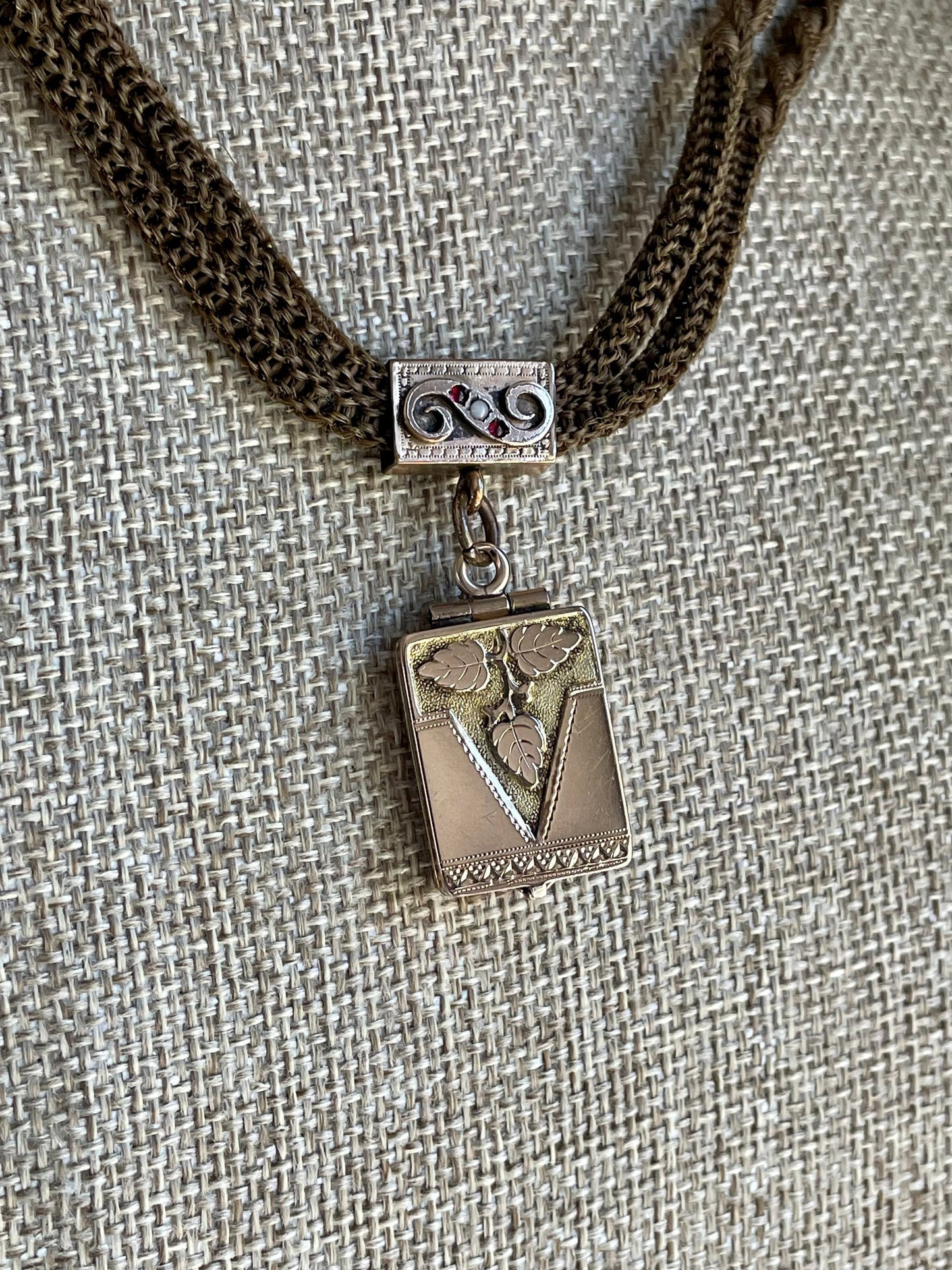 A Victorian Braided Hair Watch Chain with 10K Rose Gold Locket