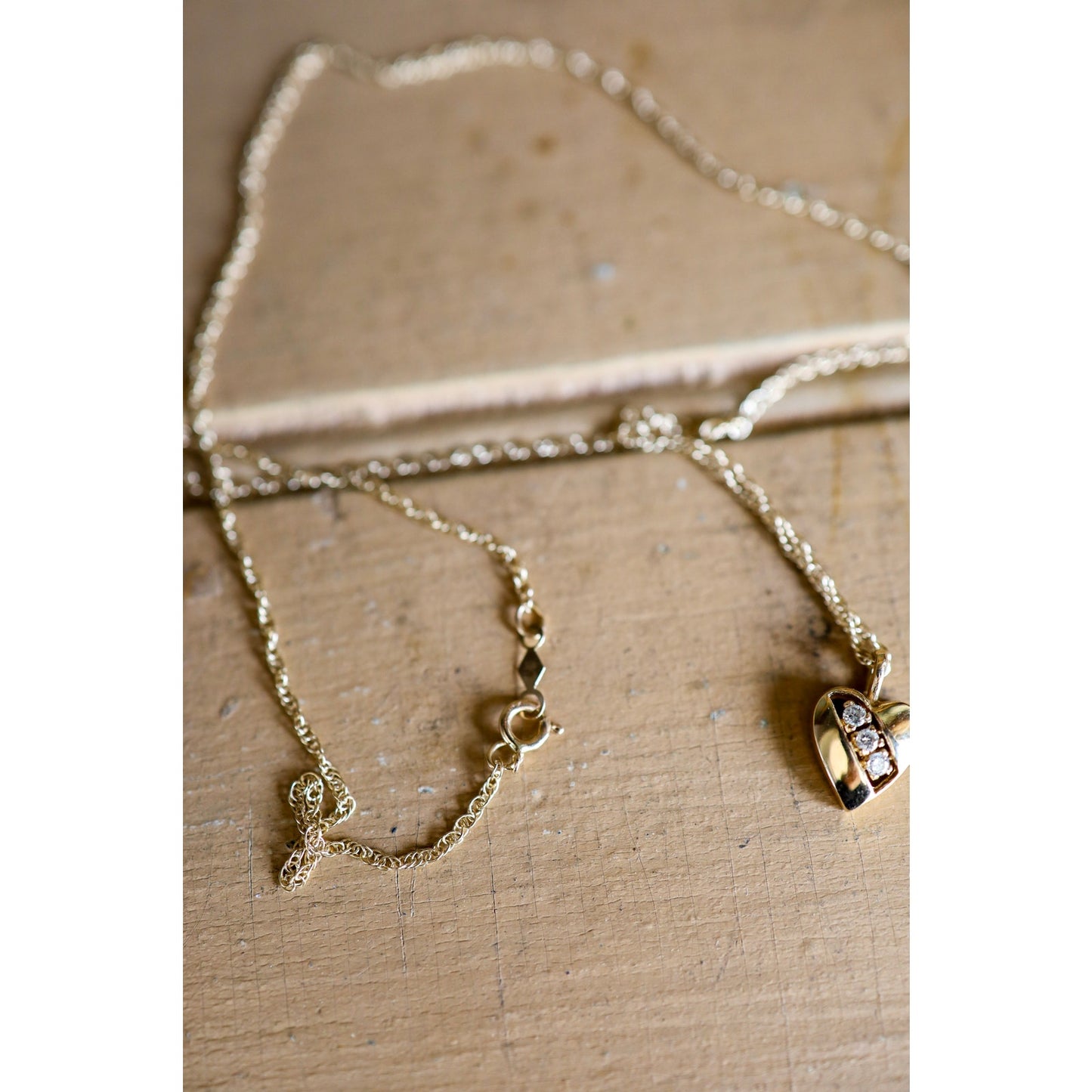 A Vintage 14K Heart Pendant Set with Diamonds on a 14K Yellow Chain