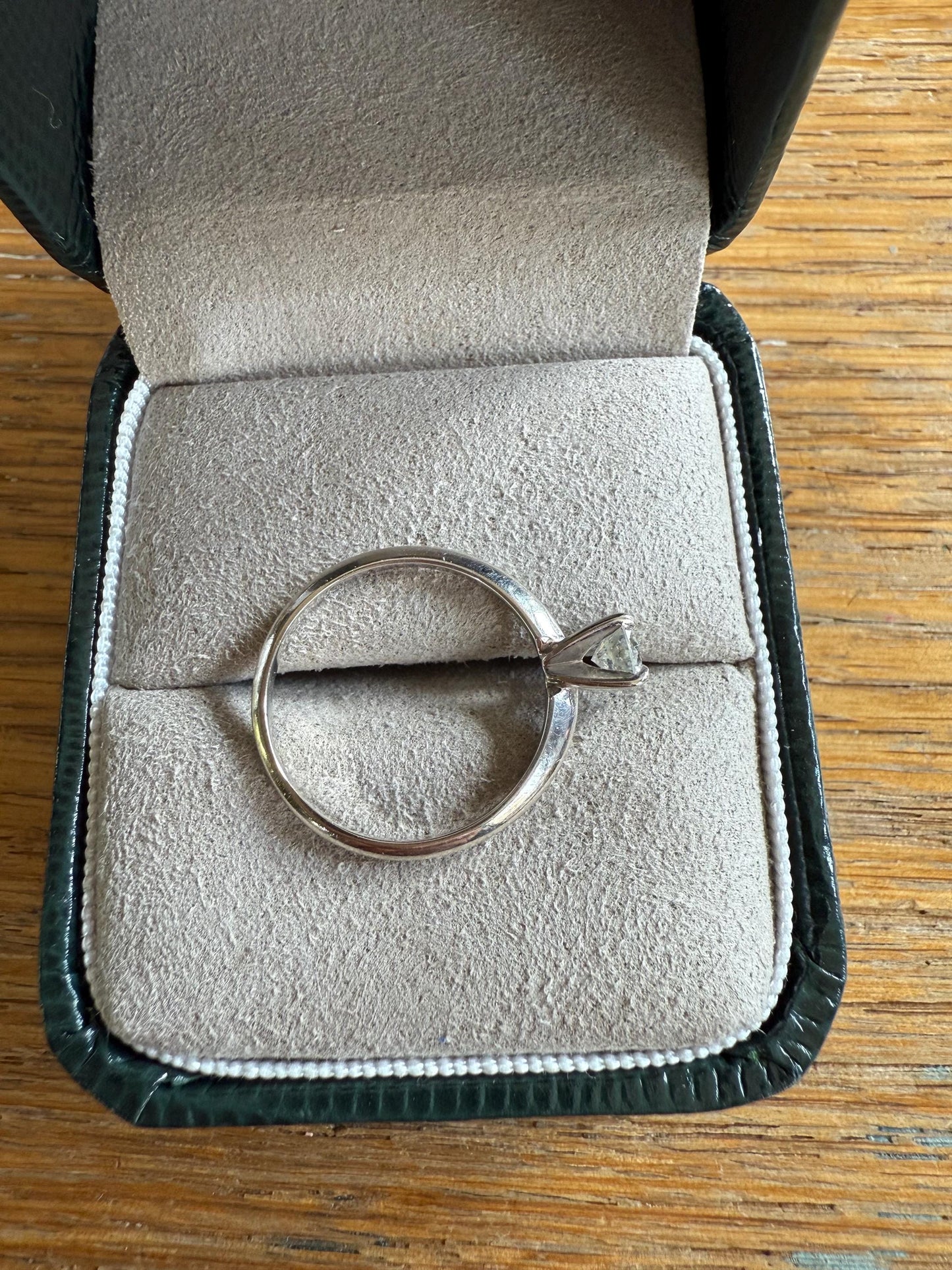 A GIA certified .42 ct Round Brilliant Cut Natural Diamond in 14K White Gold