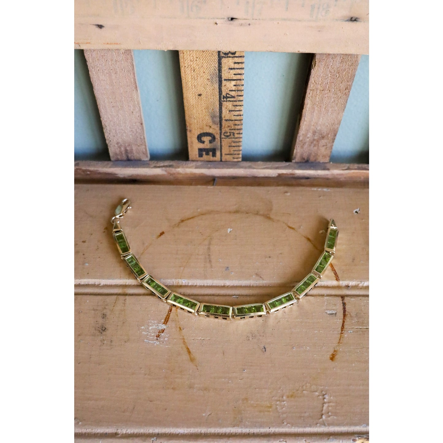 A Vintage 14K Yellow Gold Channel Set Square Set Peridot Bracelet