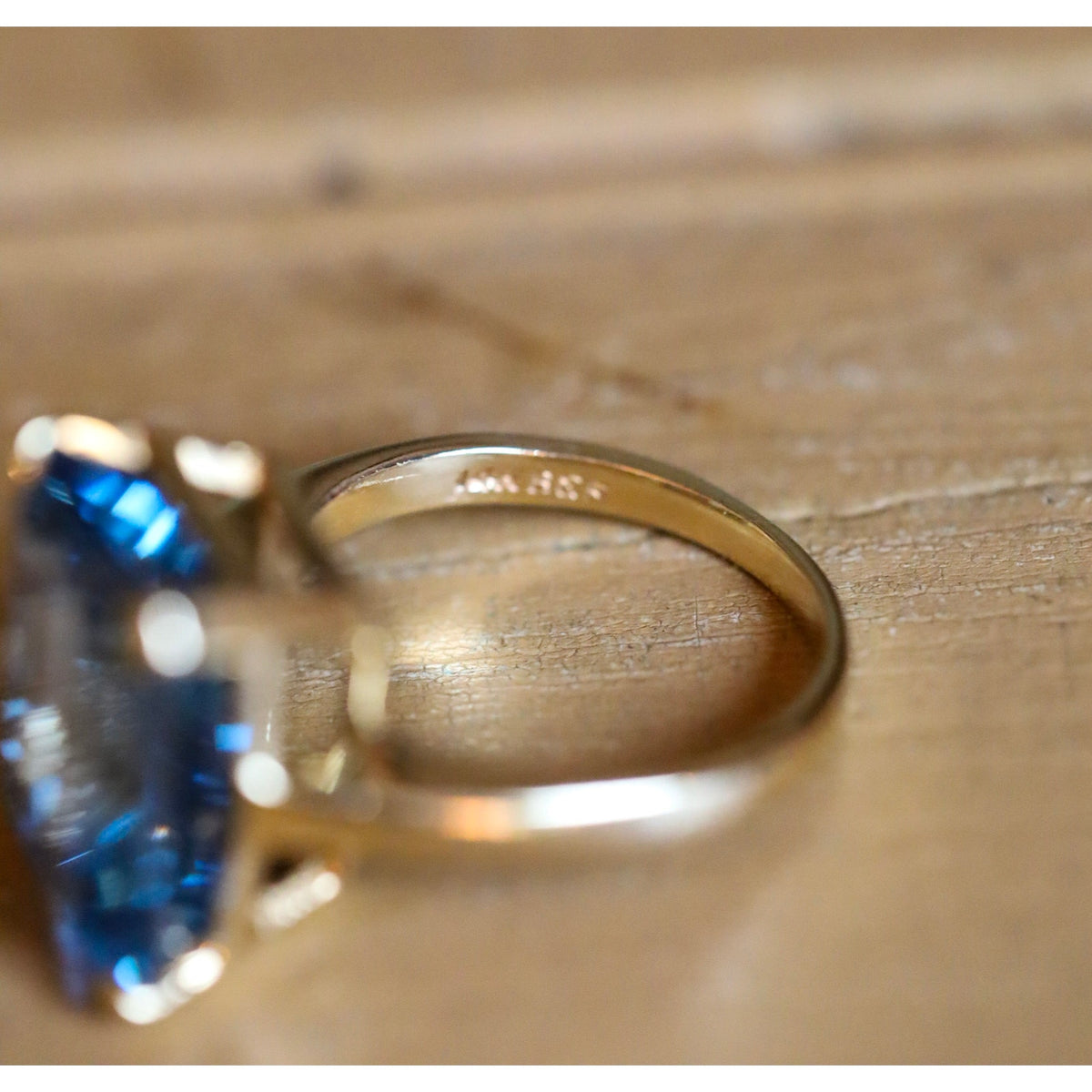 A Dramatic 14K Yellow Gold Ring Featuring a Rectangle Cut Blue Topaz