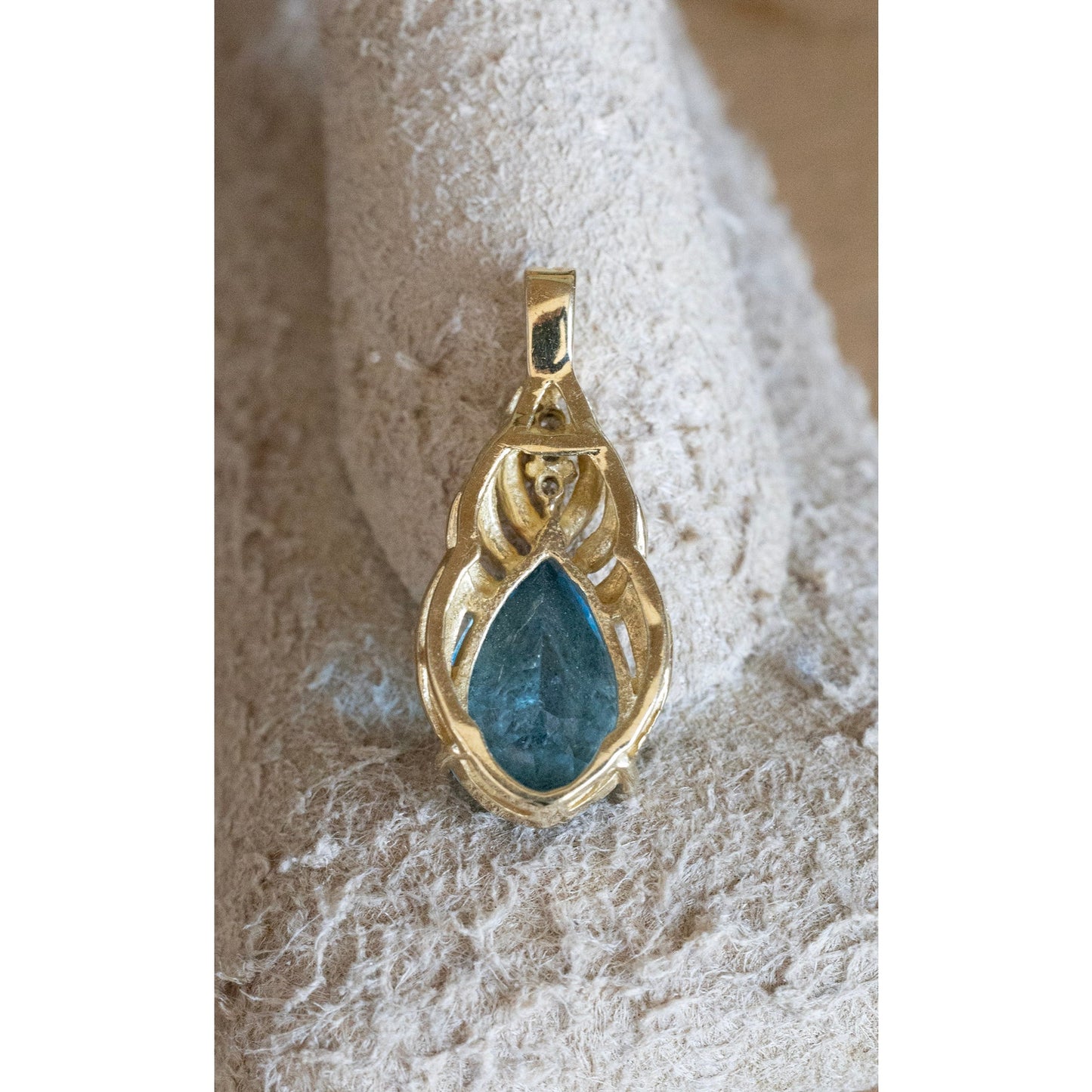 A Brilliant Blue Topaz and Diamond 10K Yellow Gold Pendant