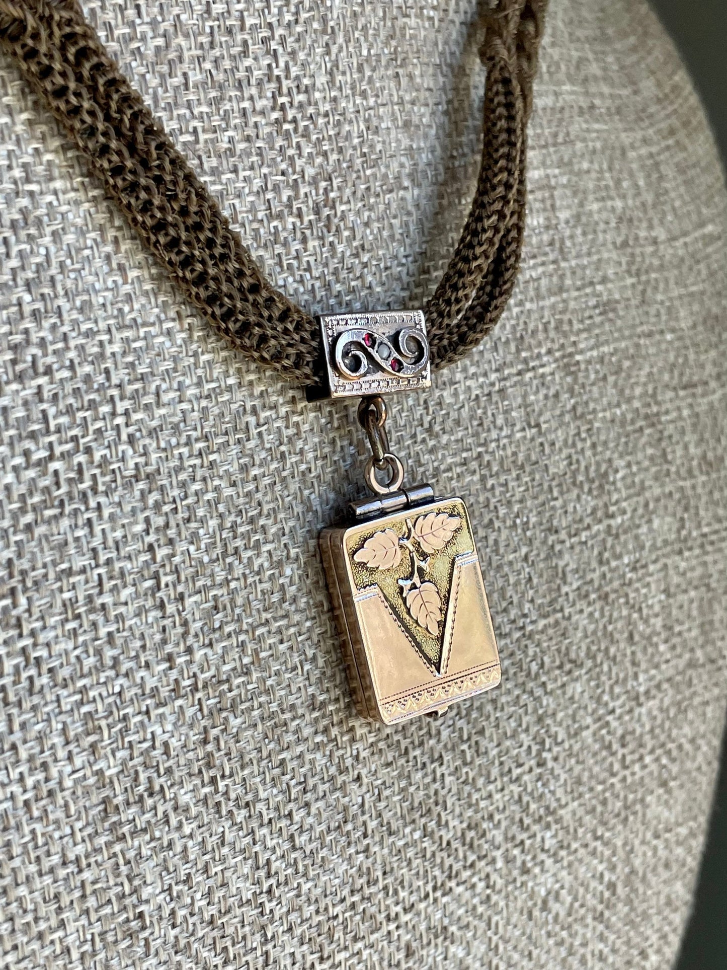 A Victorian Braided Hair Watch Chain with 10K Rose Gold Locket