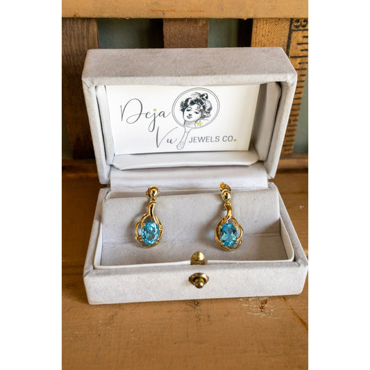 A Pair of Oval Cut Blue Topaz 10K Yellow Gold Earrings