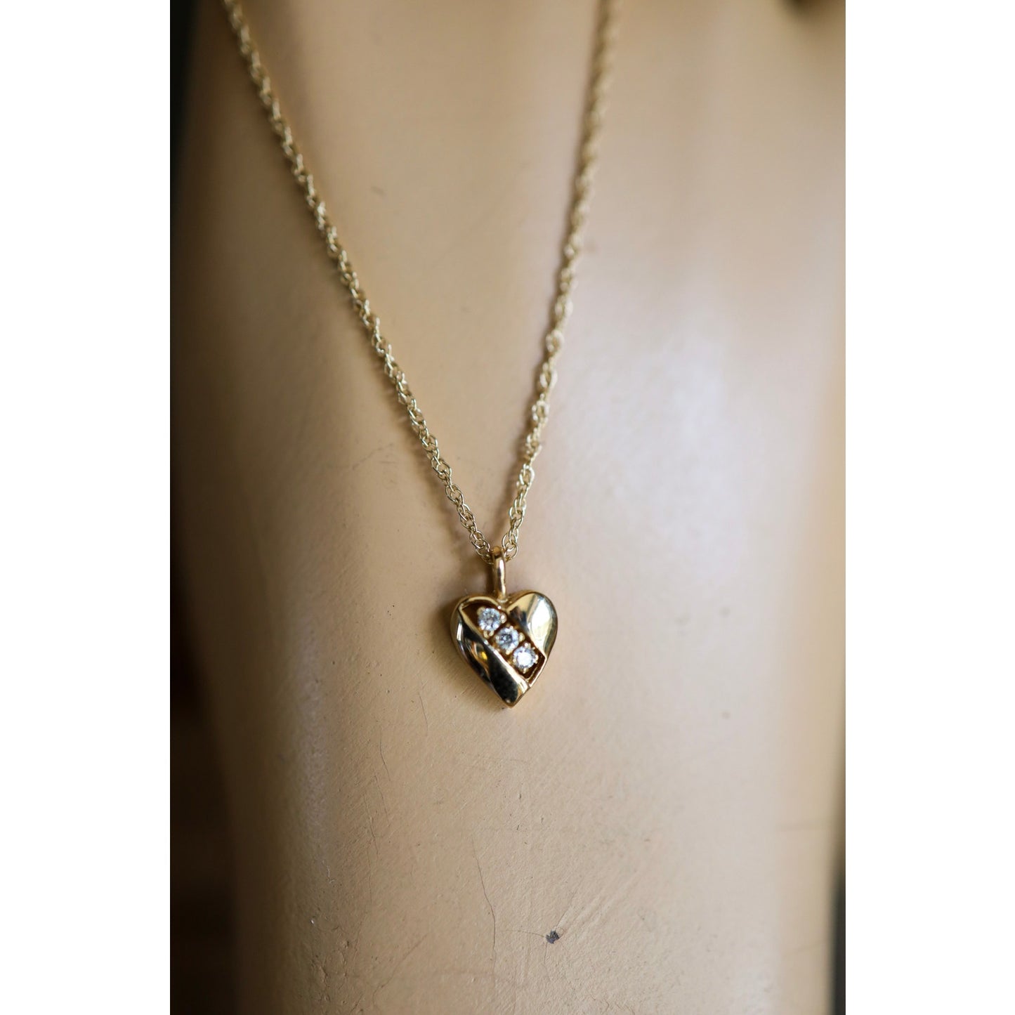 A Vintage 14K Heart Pendant Set with Diamonds on a 14K Yellow Chain
