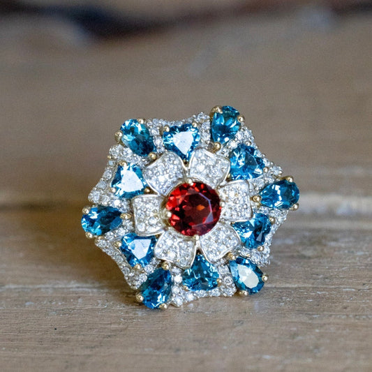 A 14K Yellow Gold Large Flower Snowflake Ring Featuring Garnet, Blue Topaz and Diamonds