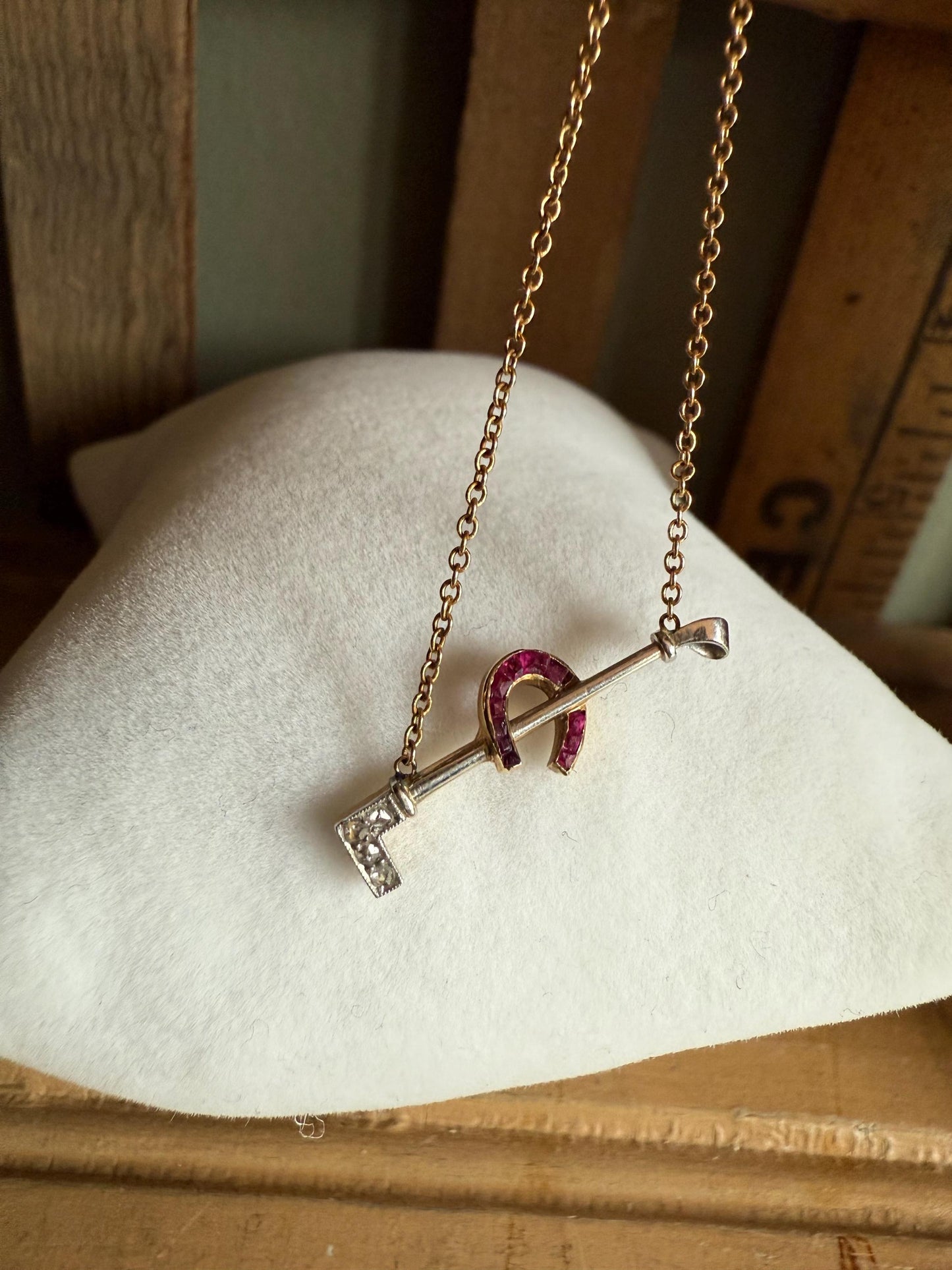 c1930 14K Yellow and White Gold Horse Crop and Lucky Ruby Set Horseshoe Necklace
