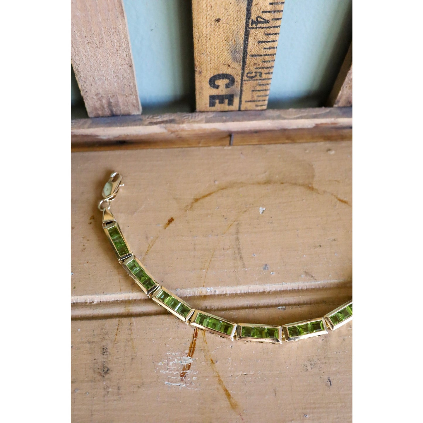 A Vintage 14K Yellow Gold Channel Set Square Set Peridot Bracelet