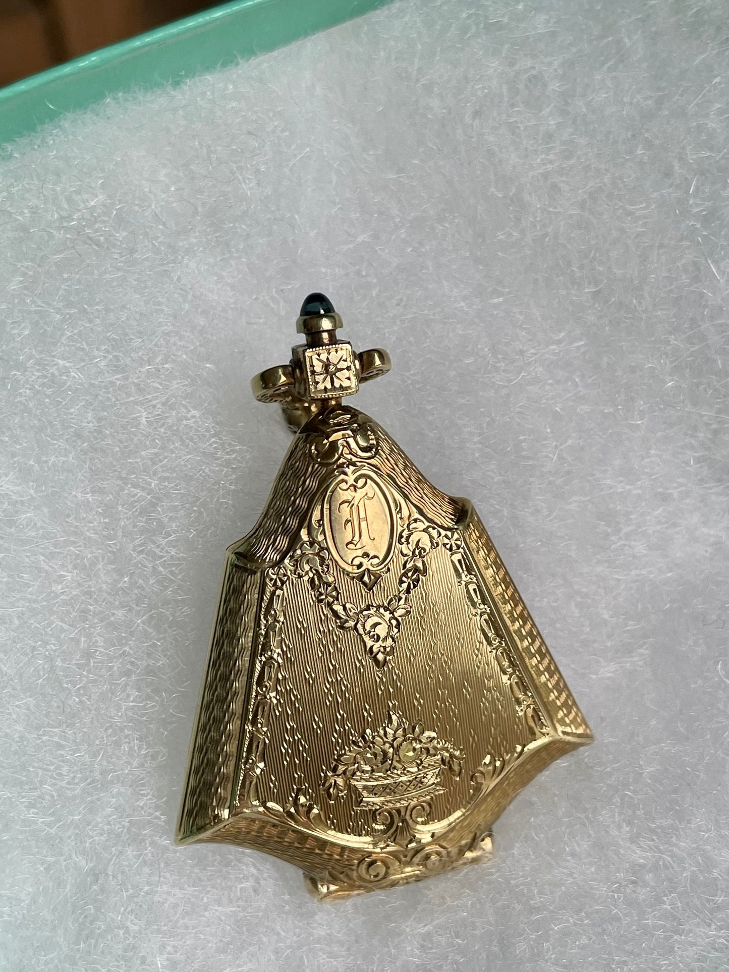 An Fine Edwardian 14K Yellow Gold Engine Turned Locket with Sapphire Cabochon Push Clasp