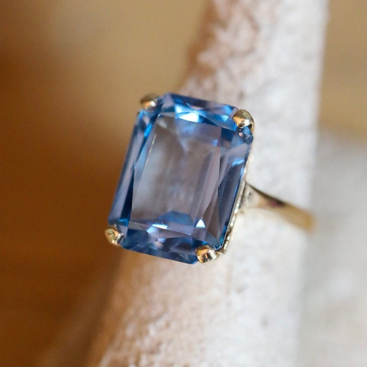 A Dramatic 14K Yellow Gold Ring Featuring a Rectangle Cut Blue Topaz