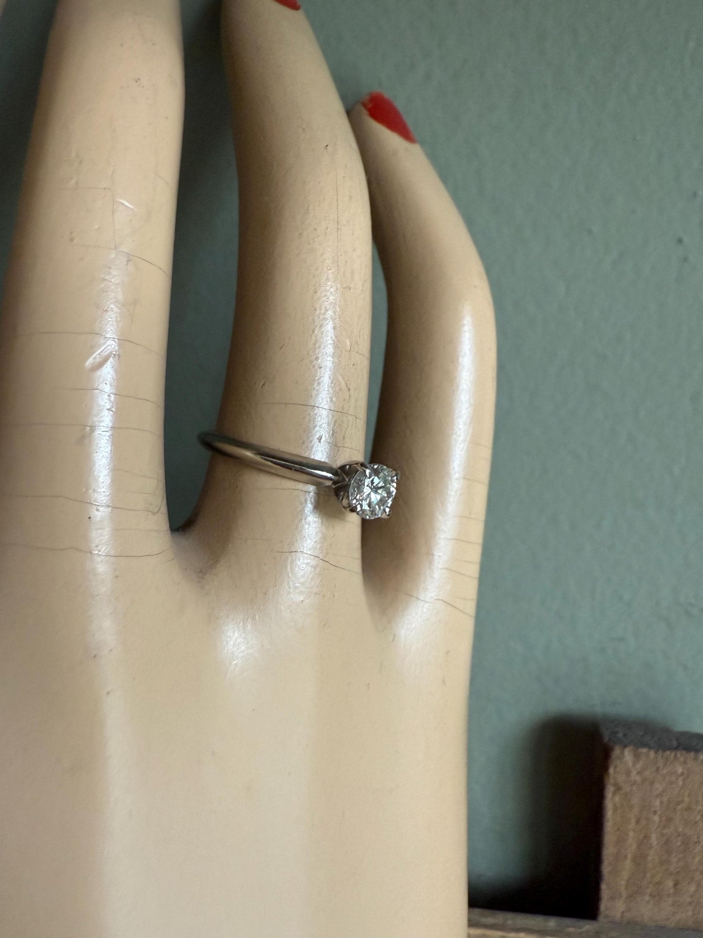 A GIA certified .42 ct Round Brilliant Cut Natural Diamond in 14K White Gold